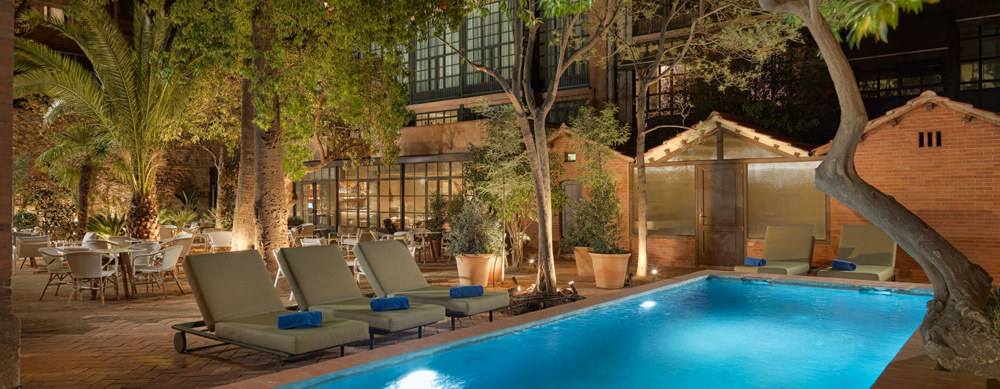 Elegant hotel in Barcelona's Eixample with rooftop terrace and historic architecture