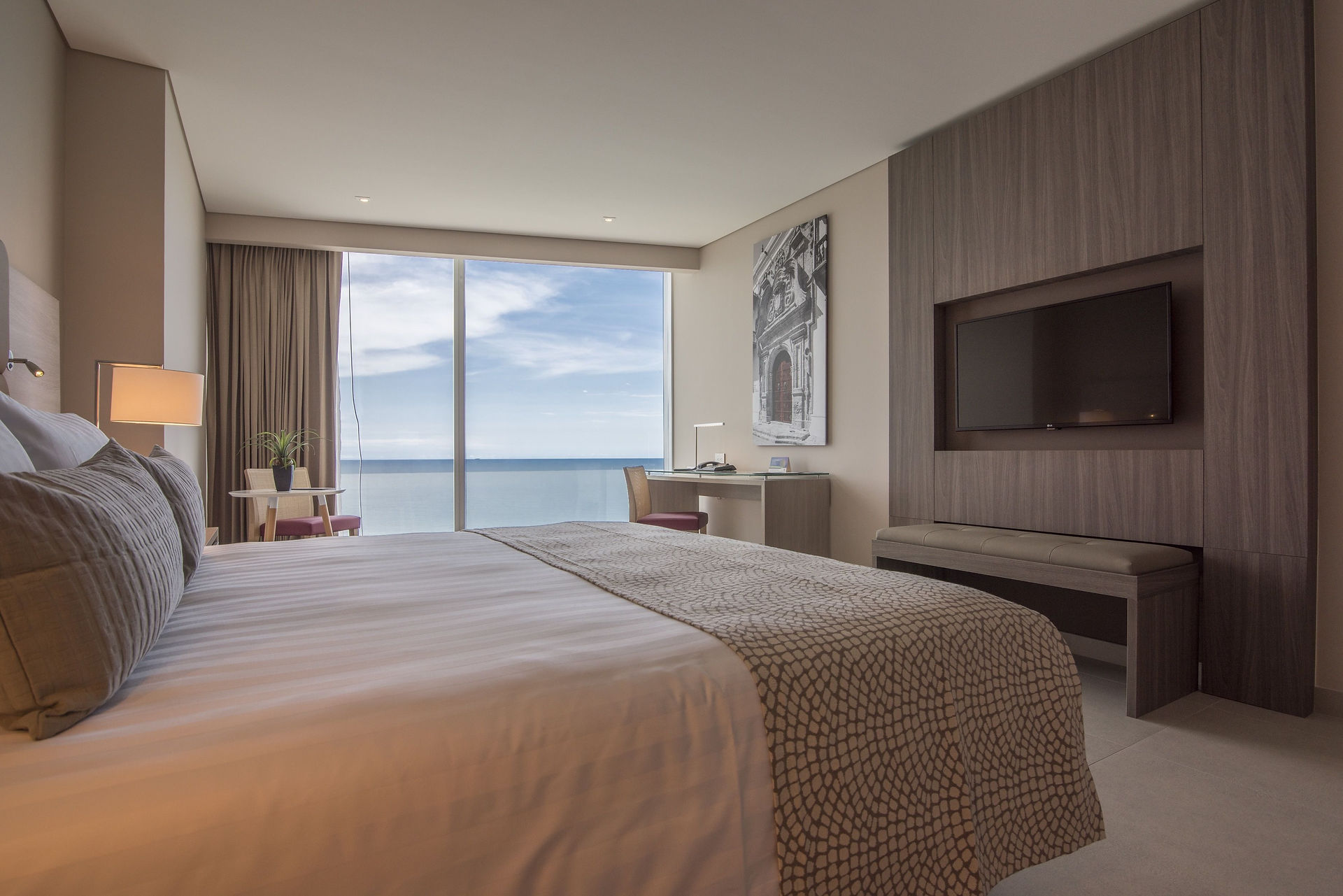 Luxury Superior Room with ocean view at Estelar Cartagena de Indias Hotel featuring premium bedding and modern amenities