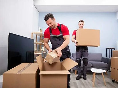 "Office space being prepped for a move with labeled boxes."