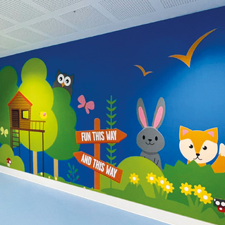 a wall with a sign that says fun this way and this way