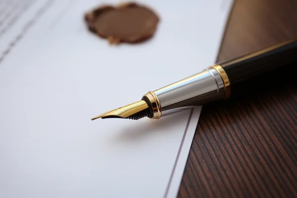 depositphotos_126649004-stock-photo-fountain-pen-and-old-notarial.webp