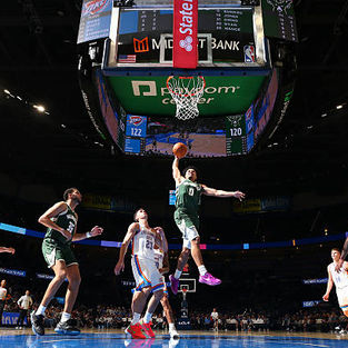 Brayden Burries of the Milwaukee Bucks slam dunking.