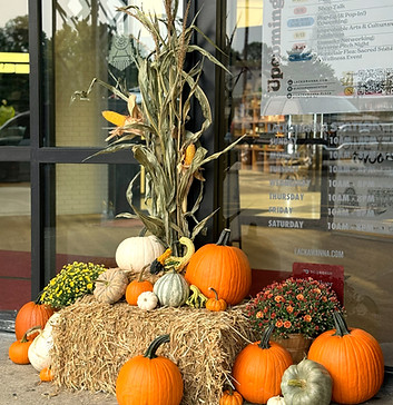 Pumpkins and cornstalks set up for condominium building