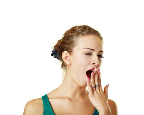 a lady clearly sleepy and yawning