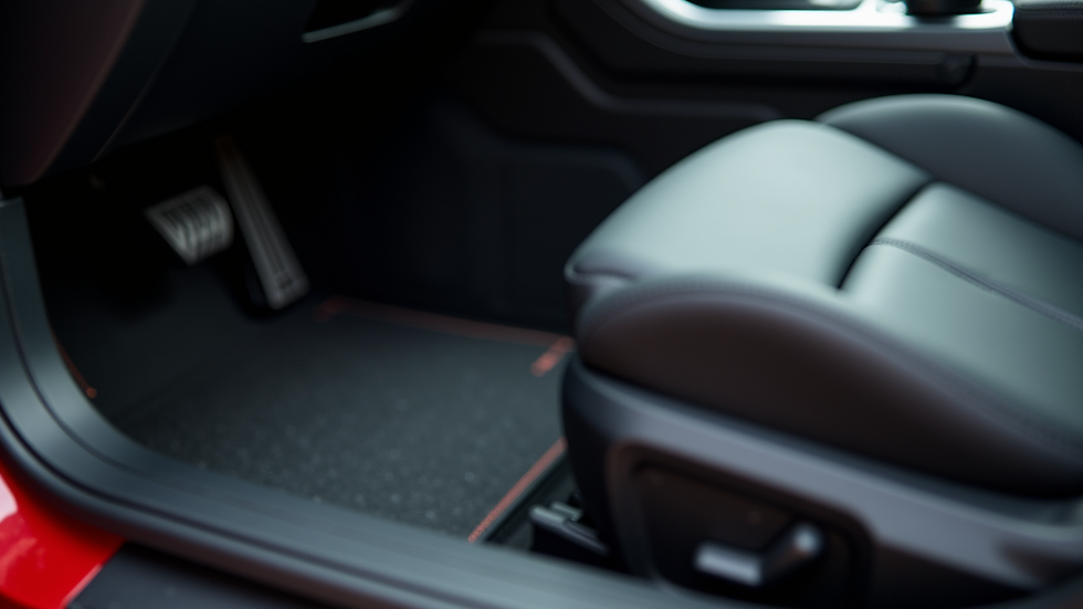 Close-up view of a car interior with custom floor mats and seat covers