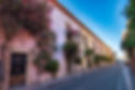 rustic-street-with-windows-and-bougainvillea-flowe-2022-05-19-06-46-51-utc.jpg