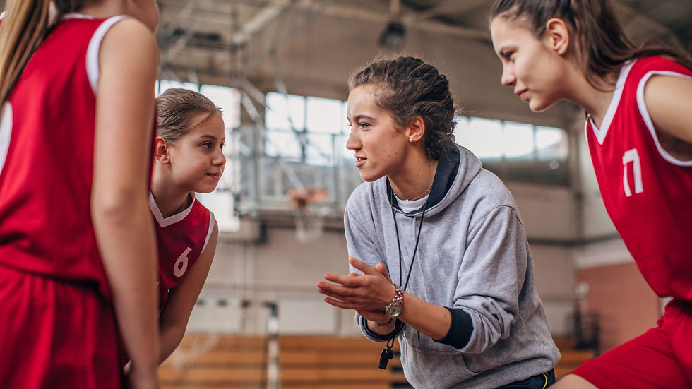 A coach talking to her team