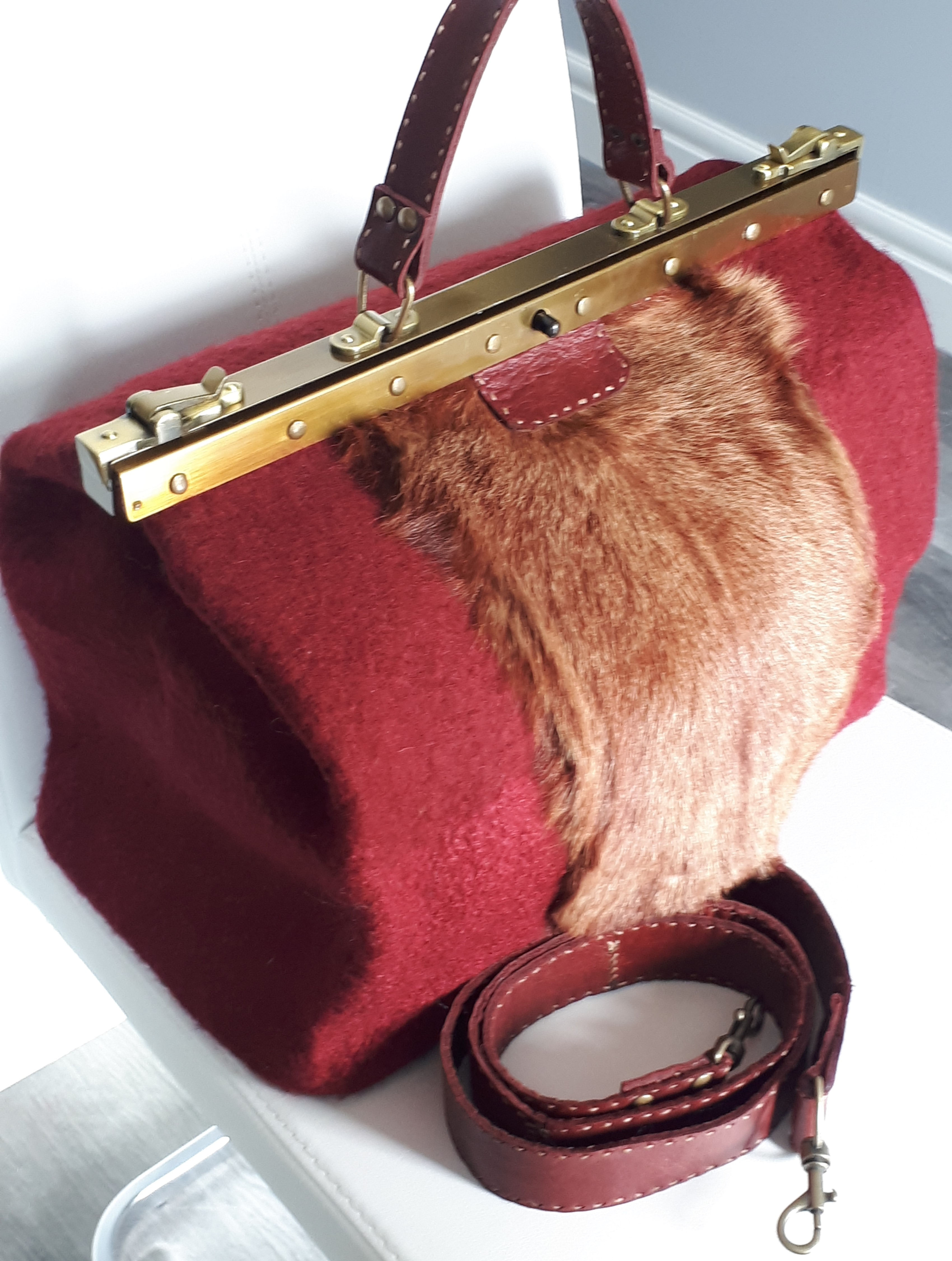 Handmade, one of a kind, felted purse with a doctor’s bag frame.