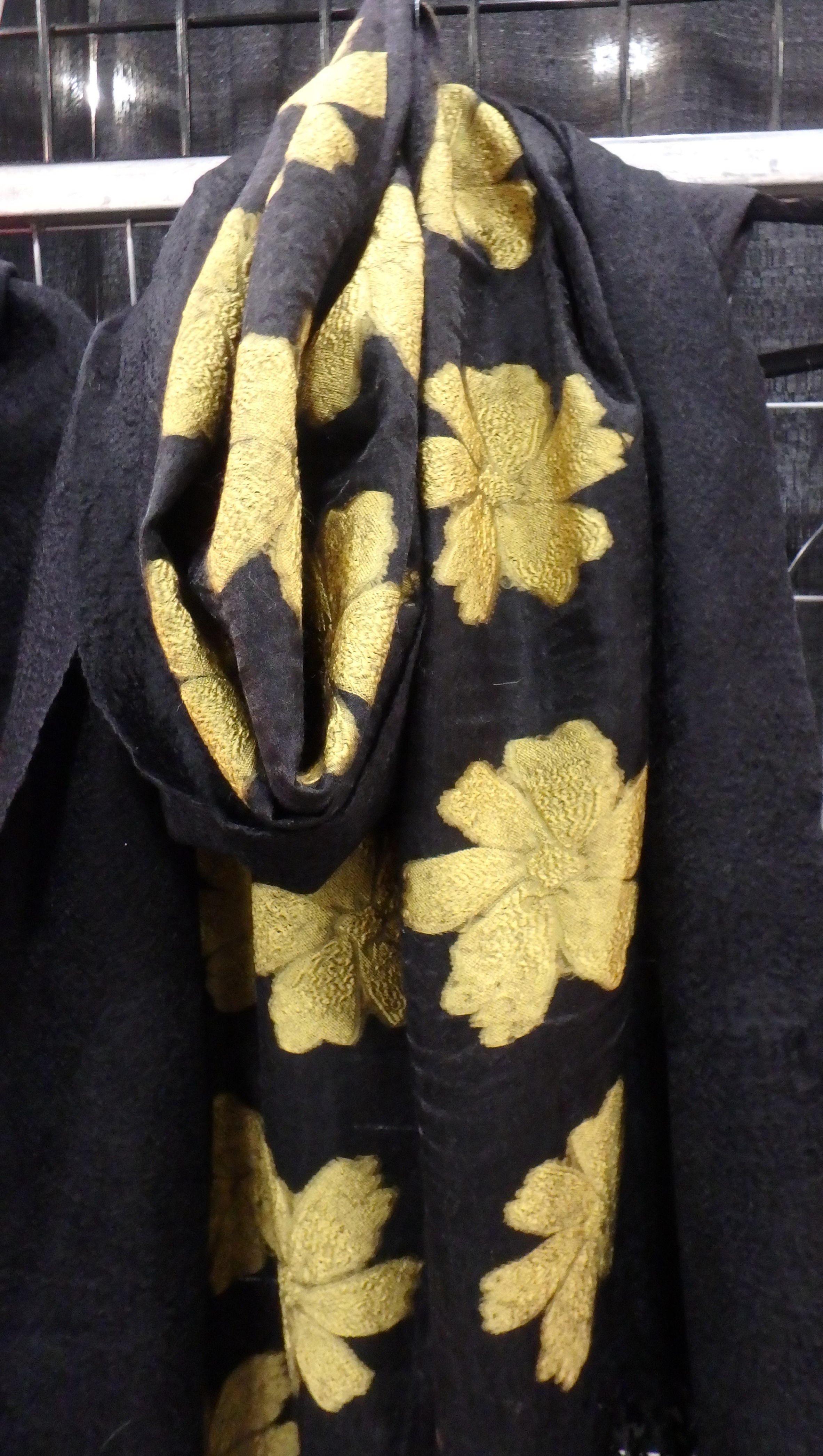 Black woolen scarf-shawl with silk decoration.