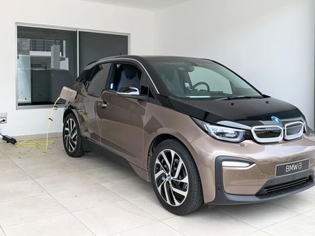 An electric vehicle being charged with a 120-volt charger