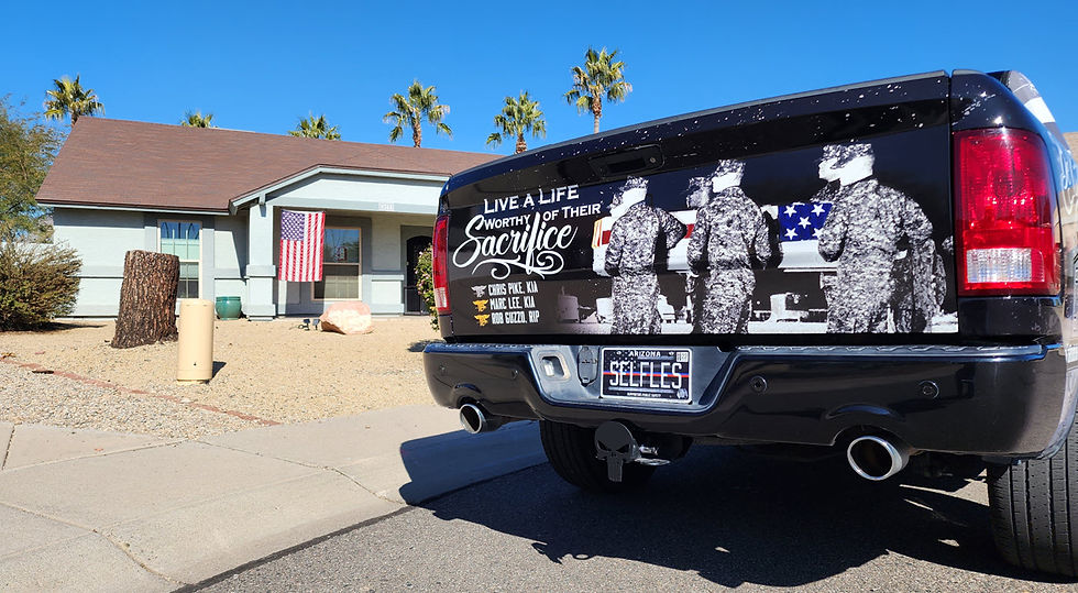 Custom memorial truck tailgate honoring Chris Pike with the message “Live a Life Worthy of Their Sacrifice” parked outside an Arizona home with an American flag.
