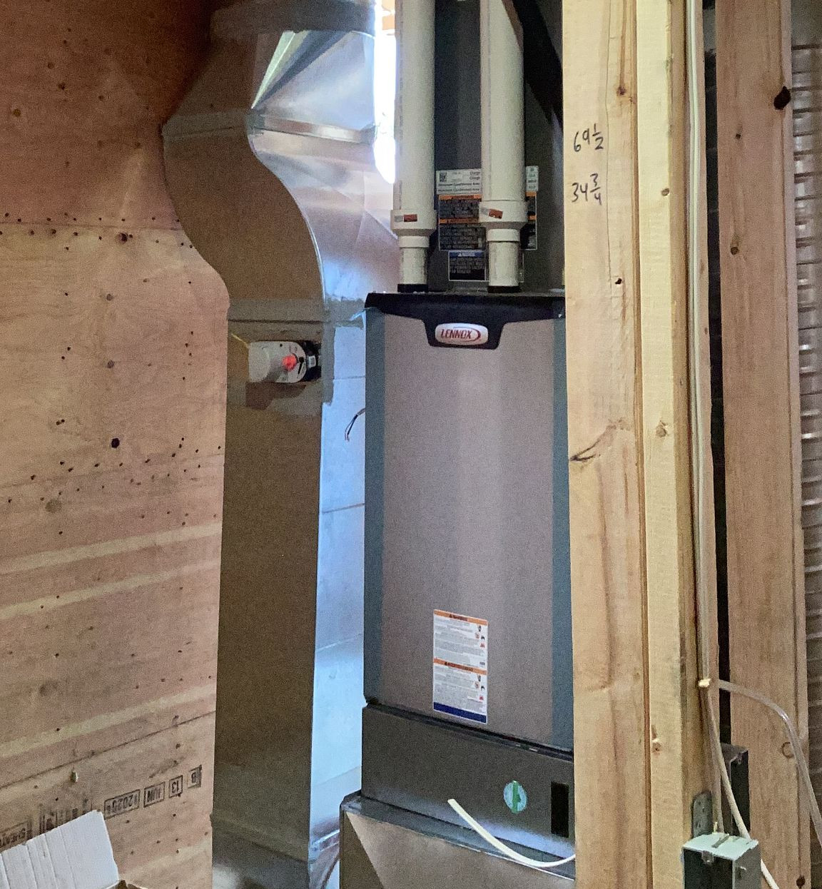 Close-up view of a high-efficiency furnace installed in a clean residential mechanical room.