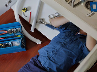Plumber Fixing Sink_edited.jpg