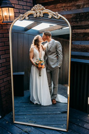 venue at chilleens bride and groom in front of mirror