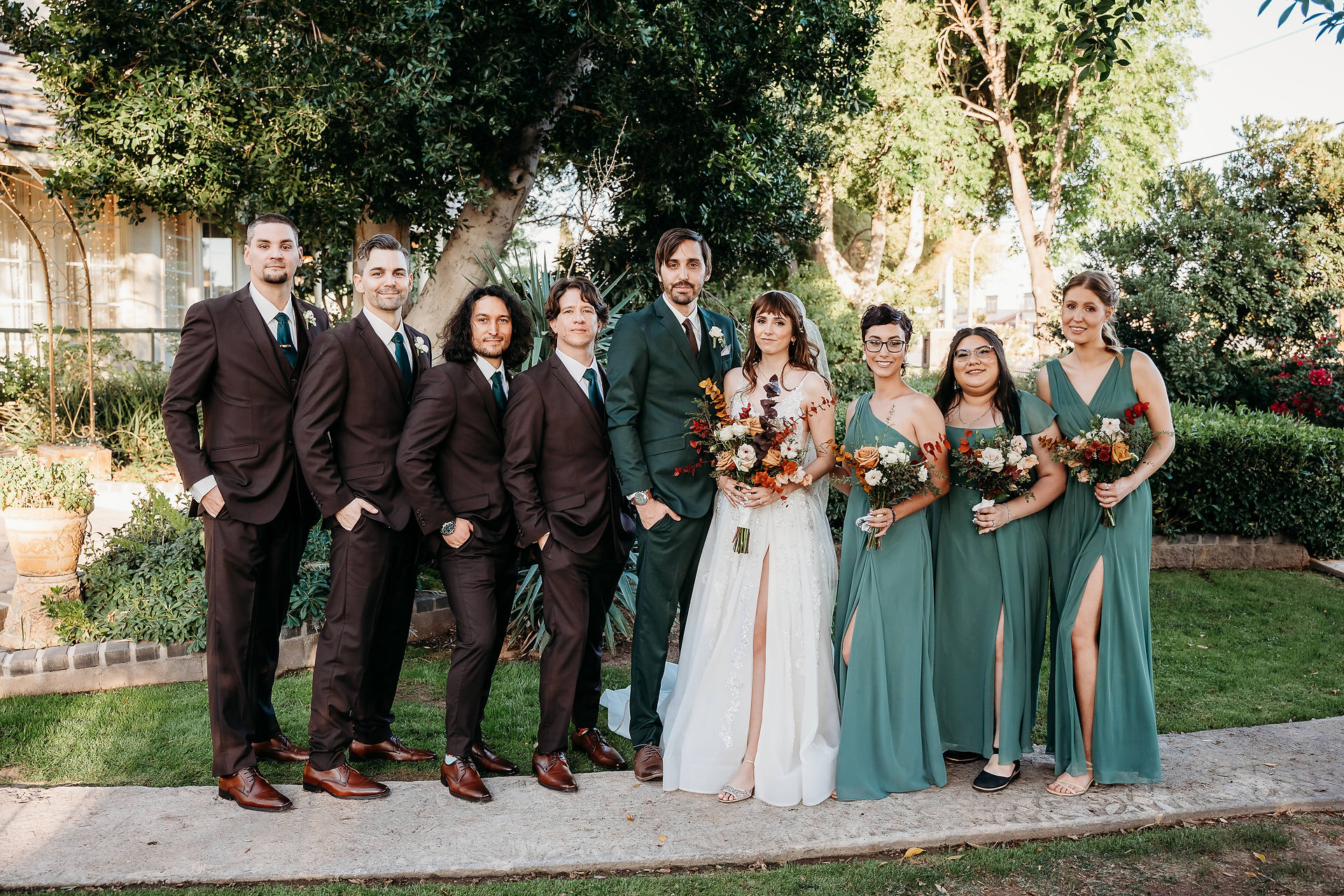 arizona wedding photographer, wedding party posing ideas, groomsmen in black tux, bridesmaid in sage green long dresses