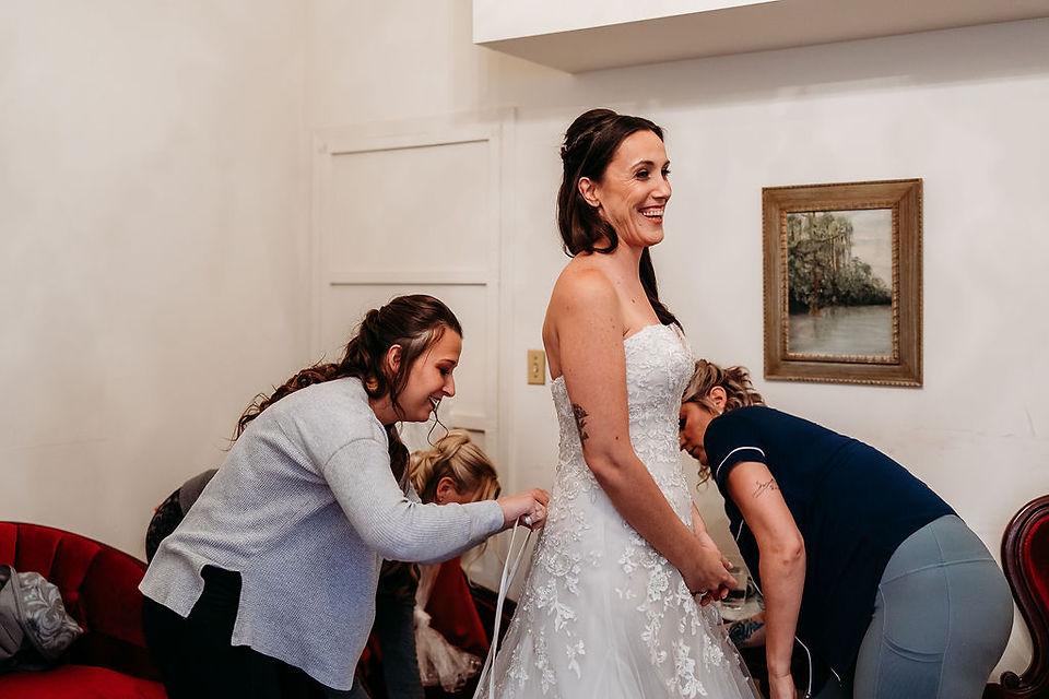 lacing up brides wedding dress, detailed floral wedding dress