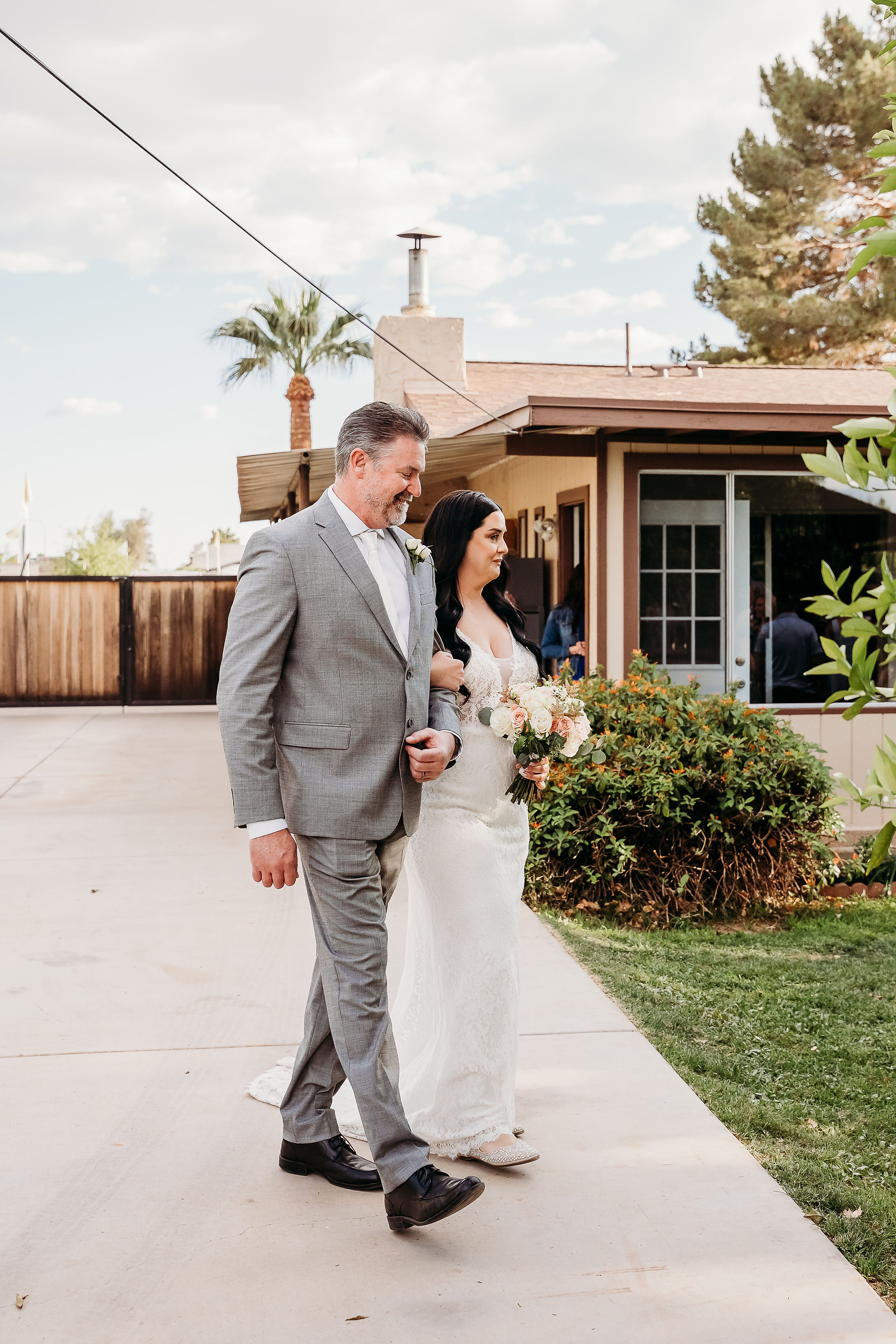bride walking down the aisle at arizona backyard wedding