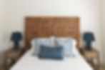 queen size bed with throw pillows