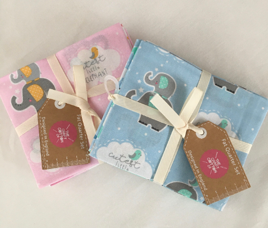 Thumbnail: Blue kids fat quarters, beside the pink version of this set.