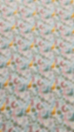 Thumbnail: Bird fabric - white, features various coloured birds and flowers in shades of pink, green and yellow - video of fabric