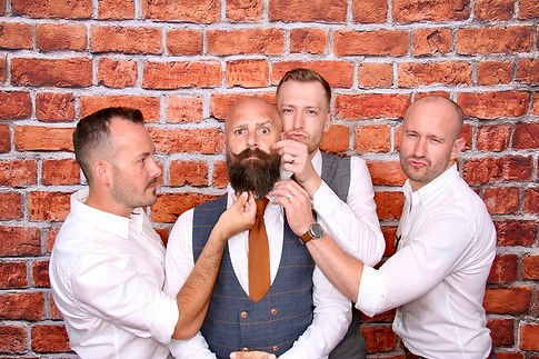 Posing with the grooms