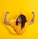 cheerful-young-woman-poses-torn-yellow-p