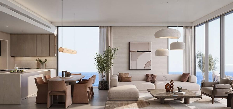 A living room and kitchen facing the sea, furnished and styled, at SKAI in Mina Al Arab