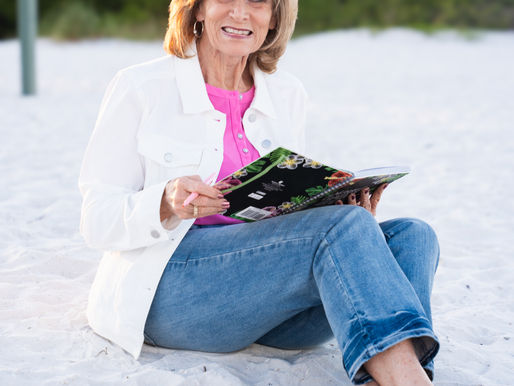 Karen reading on beach
