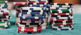 poker chips stacked up on poker table