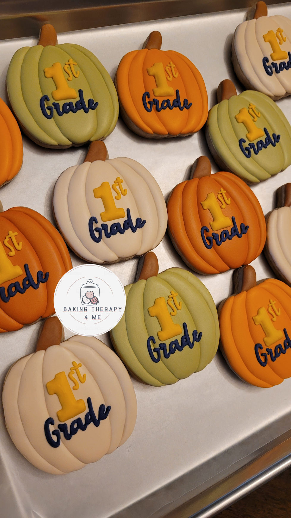 Pumpkin cookies decorated with '1st Grade'