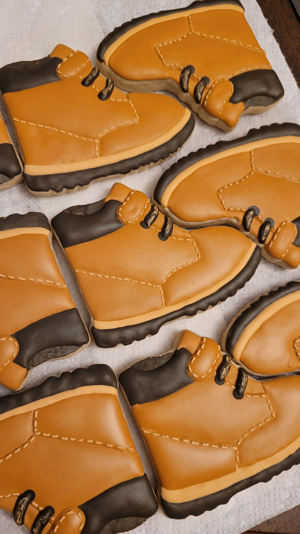 Iced cookies shaped like brown work boots