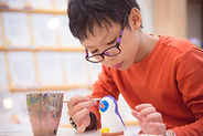 pottery painting boy.jpeg