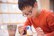pottery painting boy.jpeg