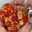Thumbnail: Sleutelhanger met rood en goud 