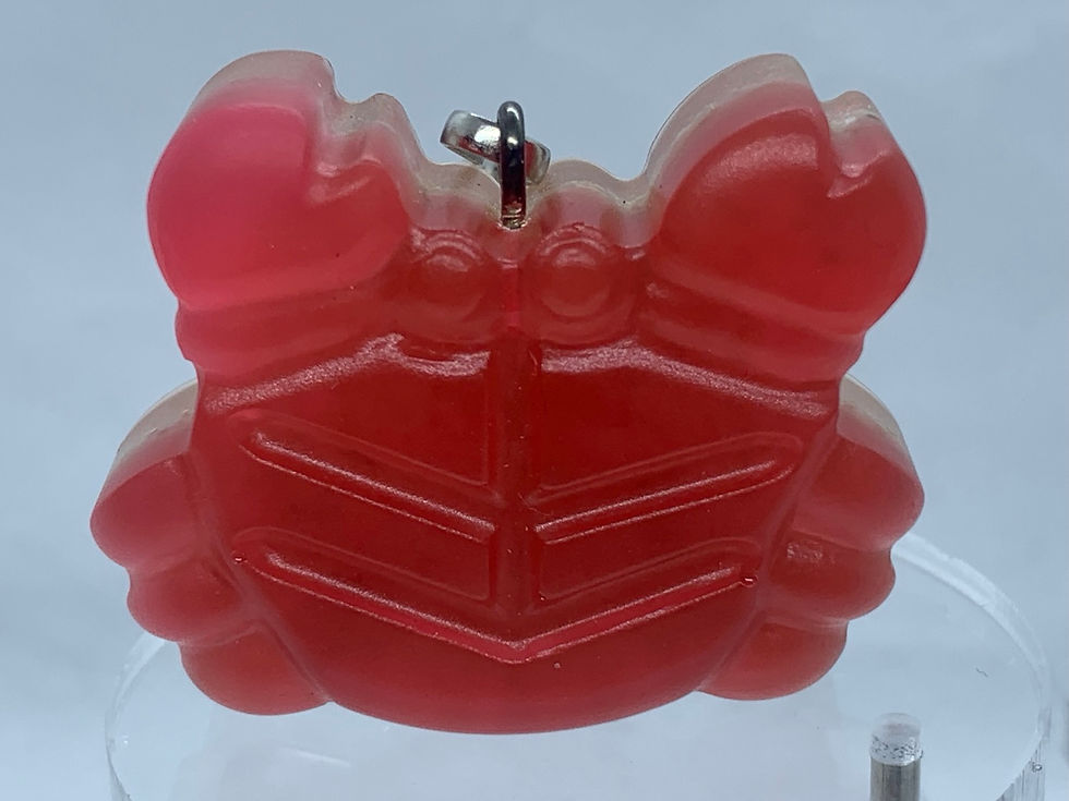 Thumbnail: Vrolijke krabsleutelhanger met zand