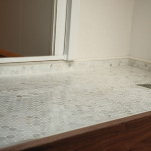 bathroom tiles inside of a luxury campervan