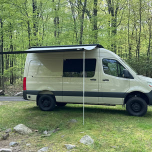 Sprinter 144WB Camper Van parked with awning out in nature
