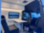 mobile office workspace with table and chairs inside a van