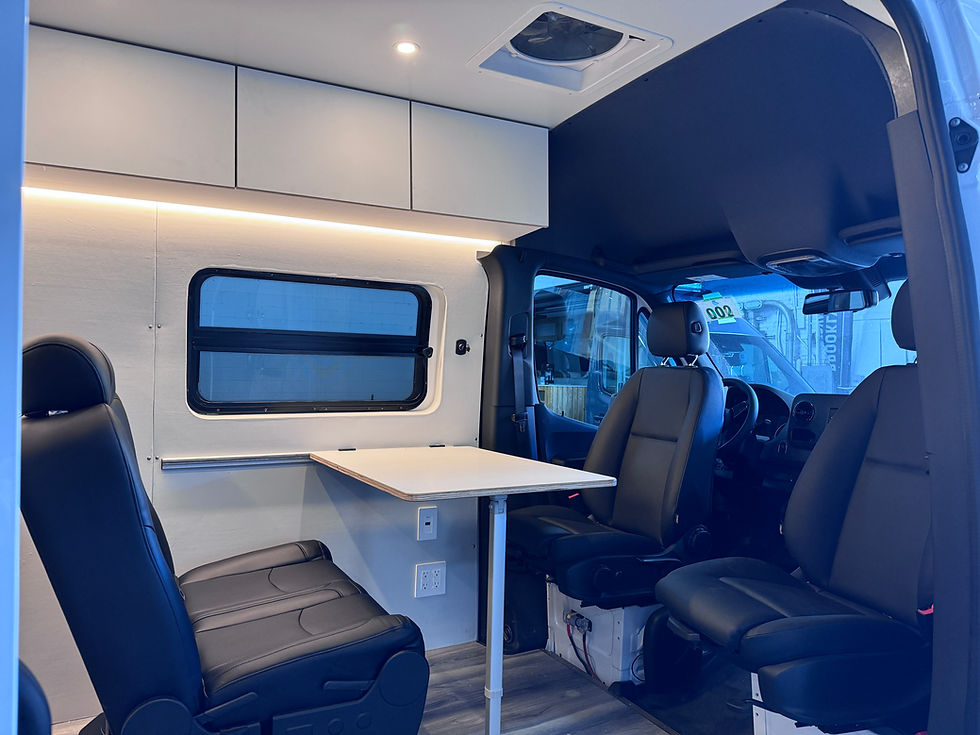 mobile office workspace with table and chairs inside a van