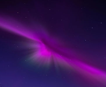 Starry night with pink northern lights