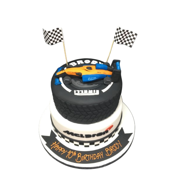 A creatively designed cake shaped like a McLaren F1 car and tyre, perfect for Formula 1 fans and car enthusiasts. Ideal for birthdays and special occasions in UK.