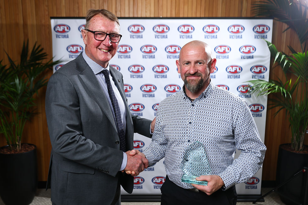 Sam Green accepting his Award from Gerald Fitzgerald.