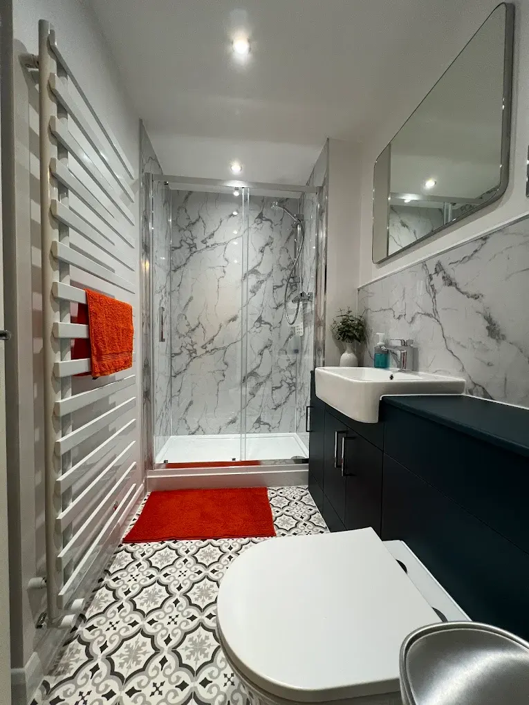 Full modern bathroom renovation in Brighton with sleek fittings, walk-in shower, and contemporary design.
