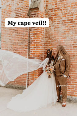 Couple Outside bride with cape veil.JPG