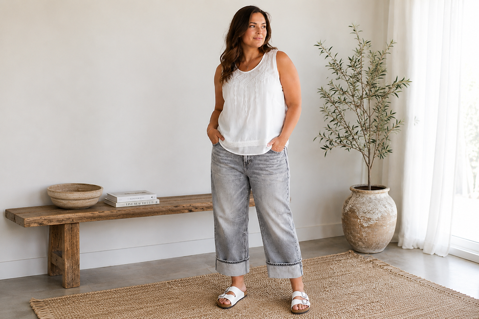 ivory shell top with grey turn up jeans on model