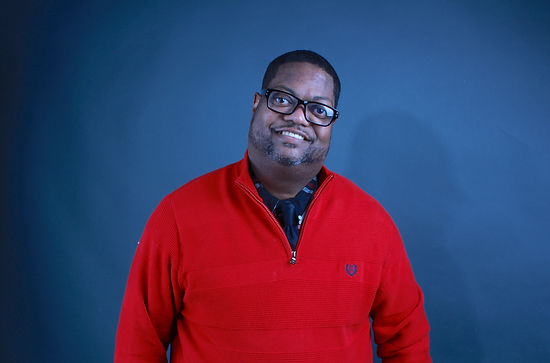 Man wearing red sweater.