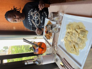 a woman eating pasta 