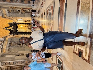 a woman standing in St. Peter's Basilica
