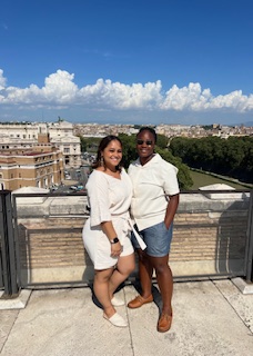 two wives on the rooftop of a castle 