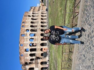 Standing in front of the Colosseum
